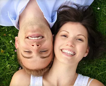 Couple smiling with CEREC technology in West Palm Beach and Palm Beach Gardens