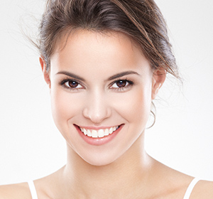 Girl smiling after beautiful cosmetic dentistry in West Palm Beach