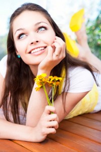 Girl smiling after visit to the cosmetic dentistry office in Juno Beach